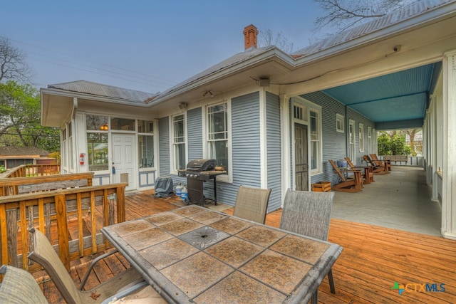 wooden deck with grilling area