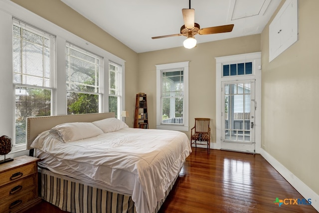 bedroom featuring access to outside, dark hardwood / wood-style flooring, and ceiling fan