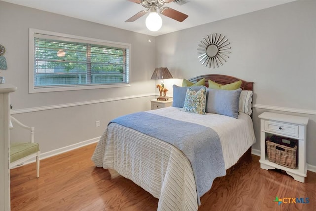 107 Spokane St, Victoria, TX 77904 - bedroom with wood finished floors, baseboards, and a ceiling fan
