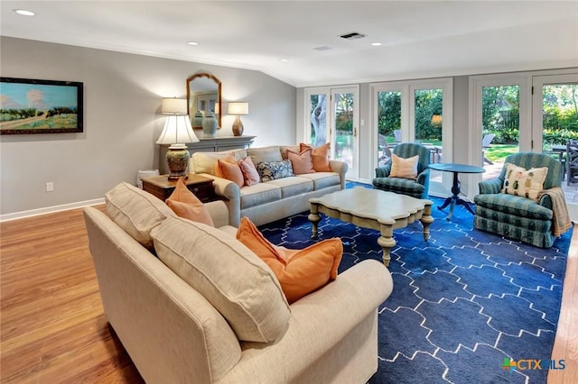 107 Spokane St, Victoria, TX 77904 - living room with wood finished floors, baseboards, recessed lighting, and lofted ceiling