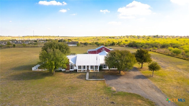 birds eye view of property featuring a rural view