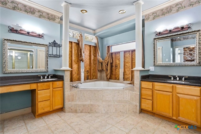 bathroom with a relaxing tiled tub, decorative columns, vanity, and ornamental molding