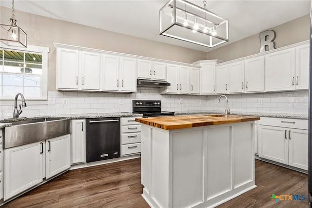 kitchen featuring white cabinets, wooden counters, and a kitchen island