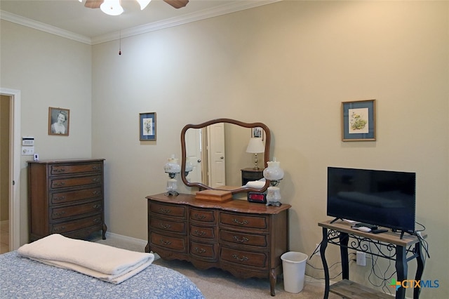 bedroom with ornamental molding, light carpet, and ceiling fan