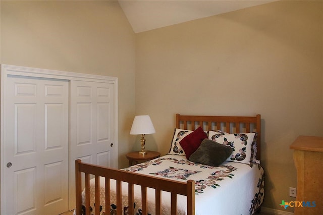 bedroom featuring a closet and lofted ceiling