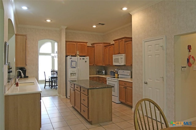 kitchen featuring light tile patterned flooring, white appliances, sink, and ornamental molding