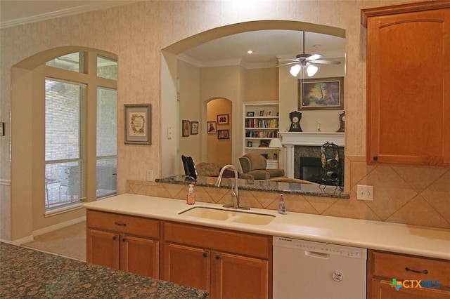 kitchen featuring sink, tasteful backsplash, ceiling fan, crown molding, and dishwasher