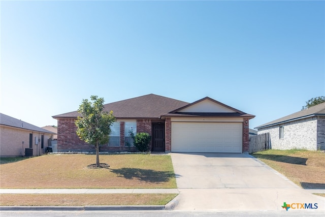 single story home with central air condition unit, a garage, and a front yard