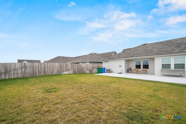 view of yard featuring a patio and central AC