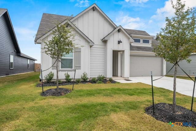 modern farmhouse style home featuring a garage and a front lawn