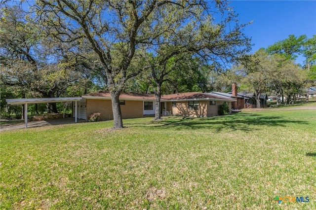 view of yard with a carport