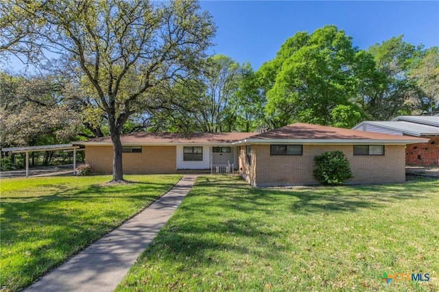 single story home featuring brick siding and a front lawn