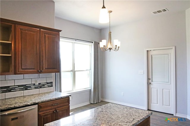 2734 Rock Rd, Troy, TX 76579 - kitchen featuring dishwasher, wood finished floors, backsplash, a chandelier, and light stone countertops