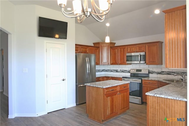 2734 Rock Rd, Troy, TX 76579 - kitchen with appliances with stainless steel finishes, a chandelier, wood finished floors, decorative backsplash, and vaulted ceiling