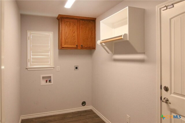 2734 Rock Rd, Troy, TX 76579 - washroom featuring dark wood-style flooring, electric dryer hookup, hookup for a washing machine, and cabinet space