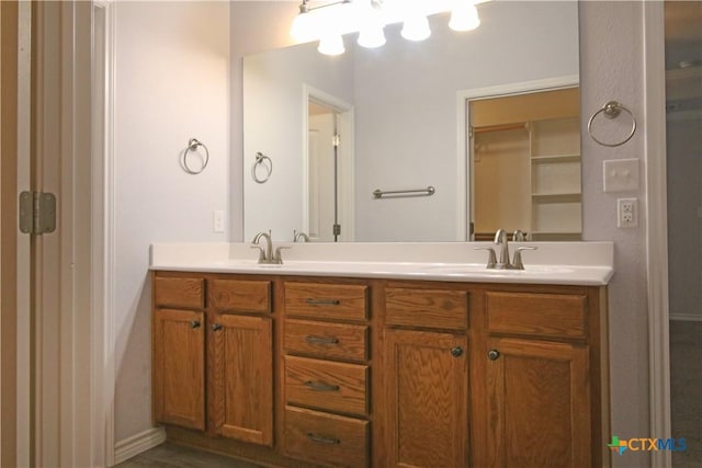 2734 Rock Rd, Troy, TX 76579 - bathroom featuring double vanity and baseboards