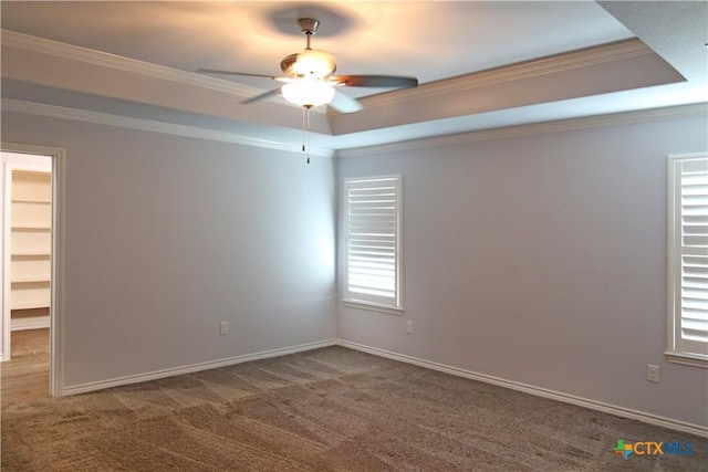 2734 Rock Rd, Troy, TX 76579 - spare room with a tray ceiling, ornamental molding, a ceiling fan, and carpet floors