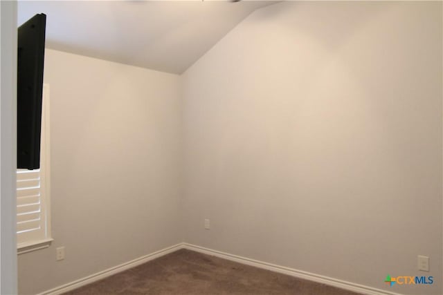 2734 Rock Rd, Troy, TX 76579 - spare room with vaulted ceiling and dark carpet
