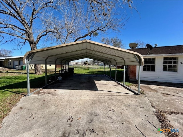 view of car parking with a lawn and a carport