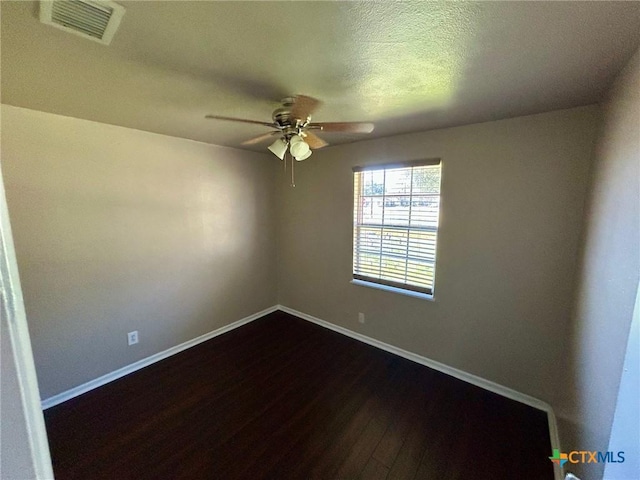 empty room featuring wood-type flooring, a textured ceiling, and ceiling fan