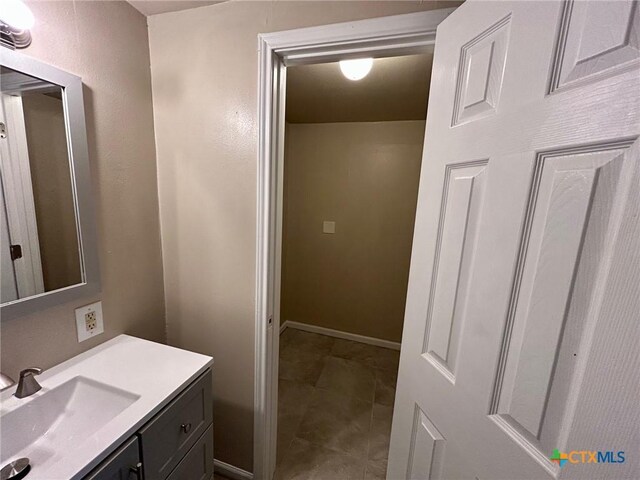 305 Larkspur St, Victoria, TX 77904 - bathroom featuring vanity and baseboards