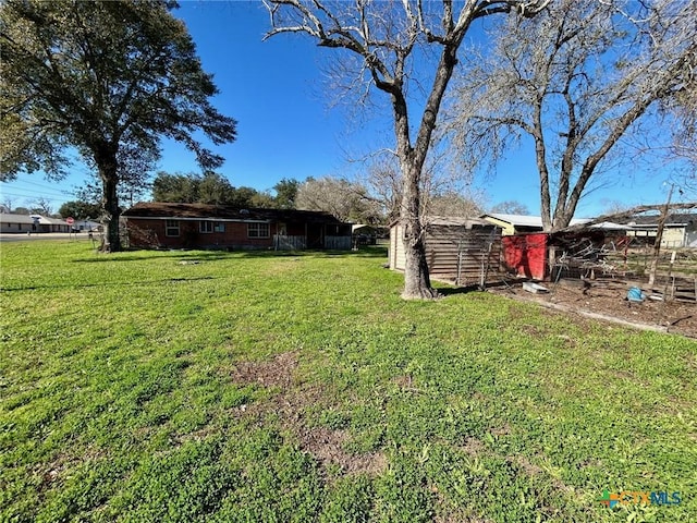 305 Larkspur St, Victoria, TX 77904 - view of yard featuring an outdoor structure