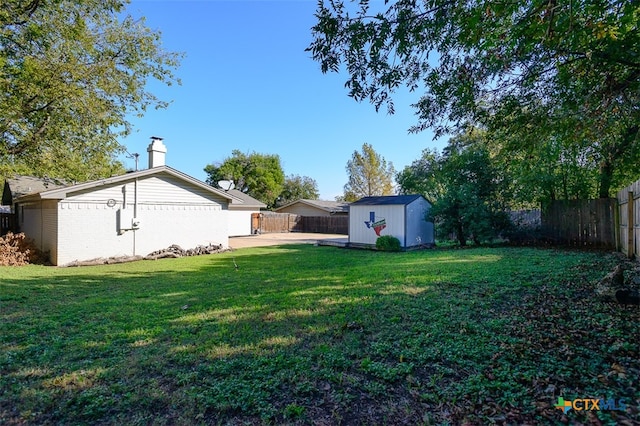 view of yard with a patio area and a shed