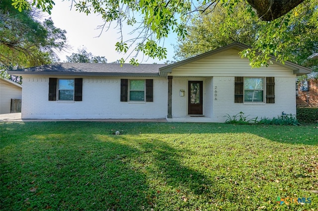 ranch-style home with a front yard