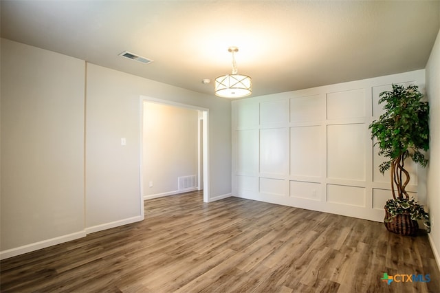 empty room featuring hardwood / wood-style flooring