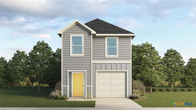 view of front of property featuring a garage and a front lawn