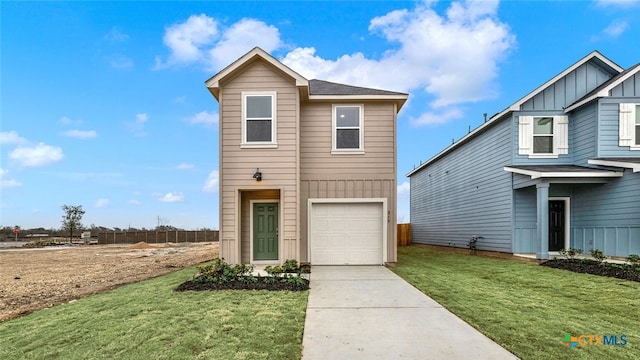 front facade with a garage and a front lawn