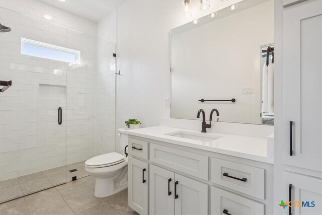 127 Cumberland Dr, Belton, TX 76513 - bathroom featuring a shower stall, toilet, vanity, and tile patterned floors