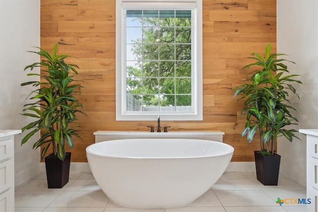 127 Cumberland Dr, Belton, TX 76513 - bathroom featuring wood walls, a soaking tub, tile patterned flooring, and vanity