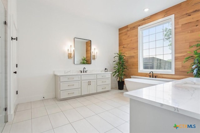 127 Cumberland Dr, Belton, TX 76513 - full bathroom with wooden walls, vanity, a freestanding bath, a shower with door, and tile patterned flooring