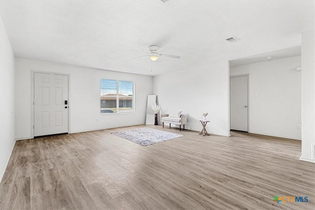 interior space with ceiling fan and light hardwood / wood-style floors