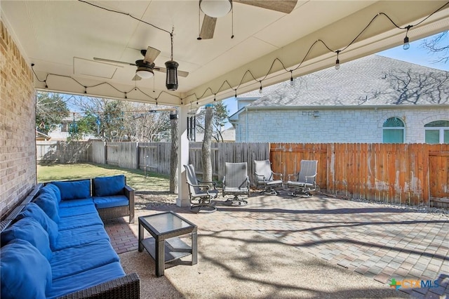 2604 Whitehurst Dr, Round Rock, TX 78681 - fenced backyard with a ceiling fan, an outdoor living space, and a patio area
