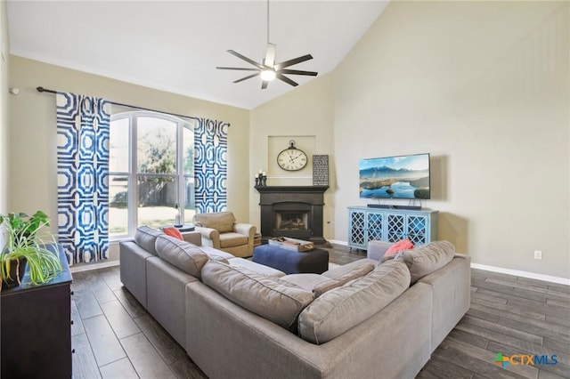 2604 Whitehurst Dr, Round Rock, TX 78681 - living area featuring a ceiling fan, vaulted ceiling, a fireplace, and dark wood-style flooring