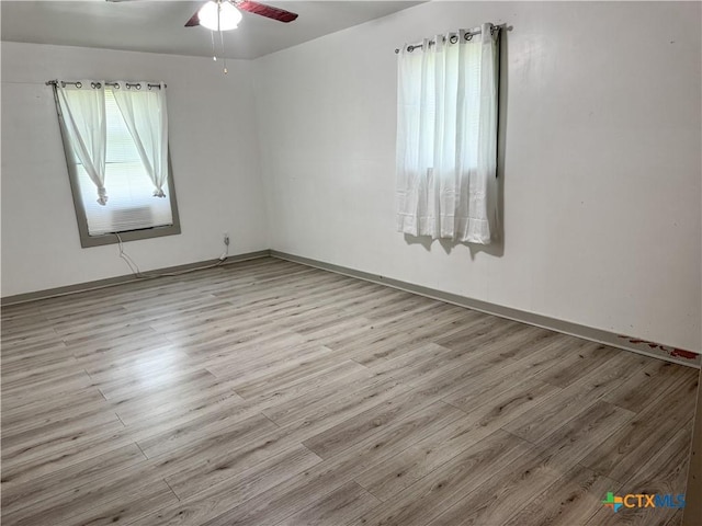 7260 Fm 531, Hallettsville, TX 77964 - empty room with wood finished floors, ceiling fan, baseboards, and cooling unit