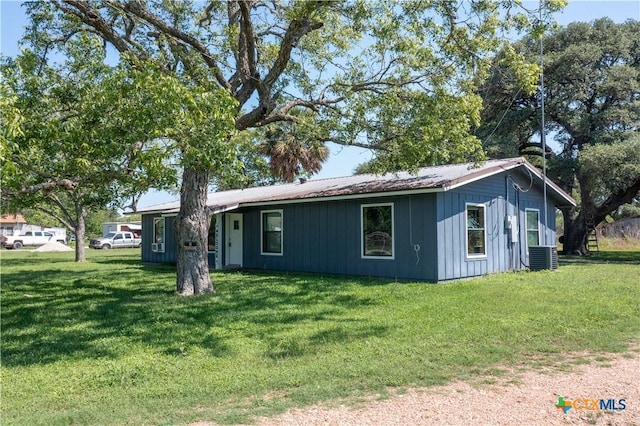 7260 Fm 531, Hallettsville, TX 77964 - ranch-style house featuring a front yard and central air condition unit