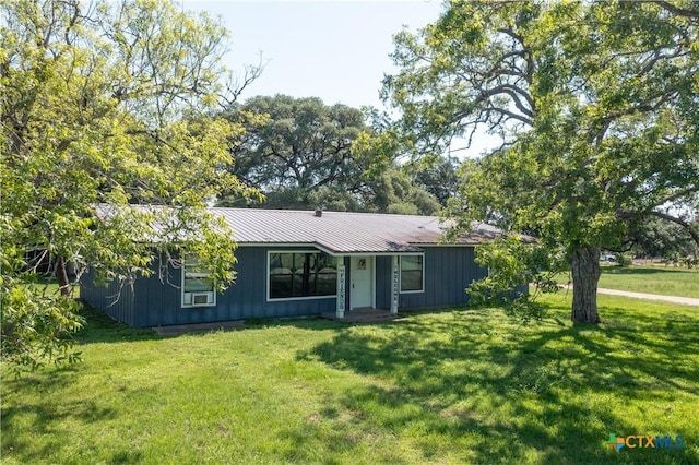 7260 Fm 531, Hallettsville, TX 77964 - single story home featuring a front lawn, board and batten siding, and metal roof