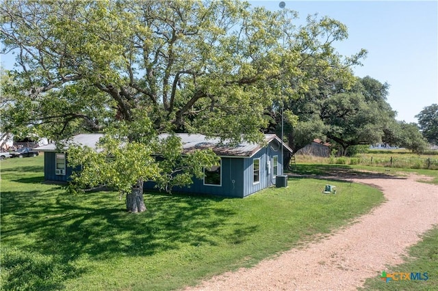 7260 Fm 531, Hallettsville, TX 77964 - view of side of home with central AC unit, a yard, and driveway