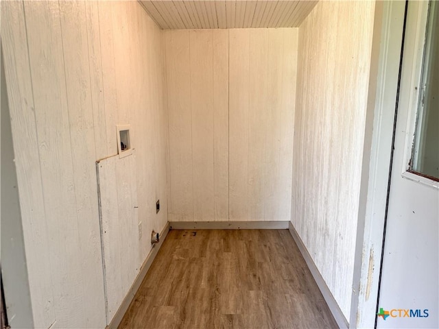 7260 Fm 531, Hallettsville, TX 77964 - clothes washing area featuring wood finished floors, washer hookup, wood walls, and electric dryer hookup