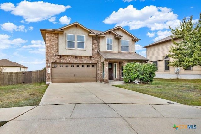 view of front of house featuring a garage and a front yard