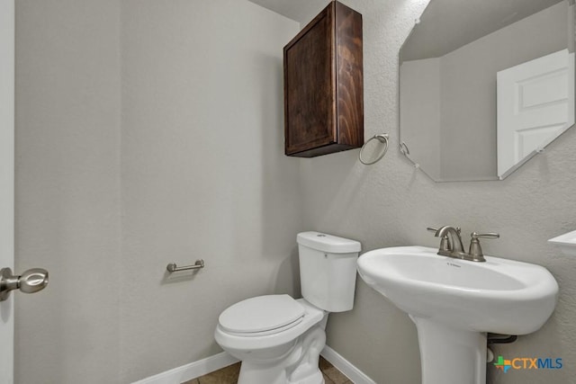 bathroom with sink and toilet