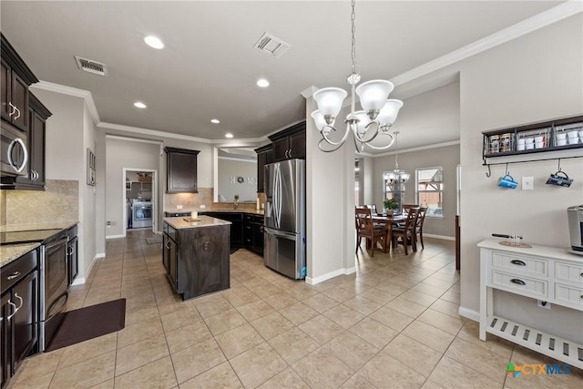 kitchen with an inviting chandelier, visible vents, appliances with stainless steel finishes, and ornamental molding