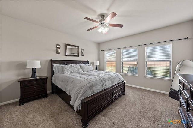 bedroom featuring baseboards, a ceiling fan, and light colored carpet