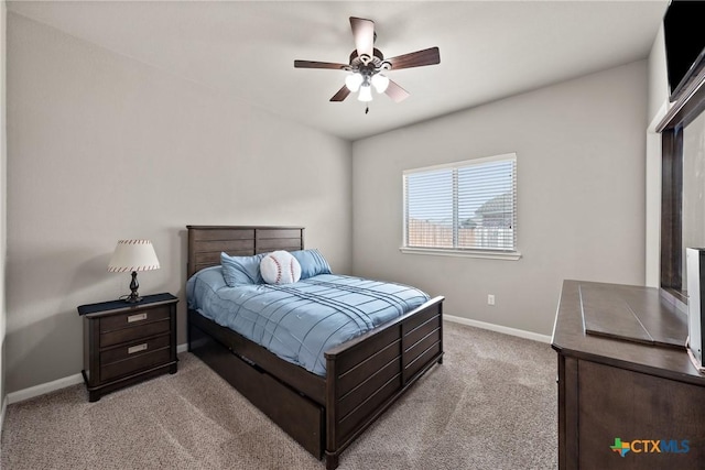 bedroom featuring a ceiling fan, carpet flooring, and baseboards