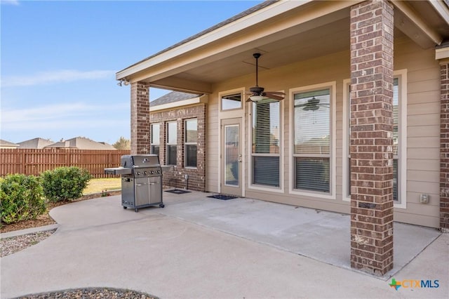 view of patio featuring a ceiling fan, fence, and area for grilling