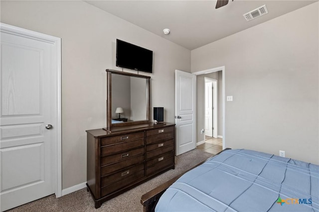 bedroom with a ceiling fan, carpet flooring, visible vents, and baseboards