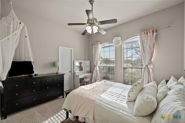 bedroom featuring a ceiling fan and light colored carpet